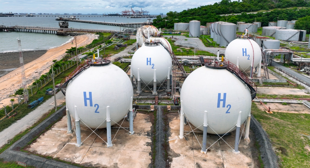 Hydrogen storage tanks near industrial facility.